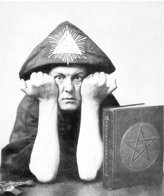Aleister Crowley with two hands closed on the side of his face, using a hat with a triangle inside and a book on his side with a pentagram draw